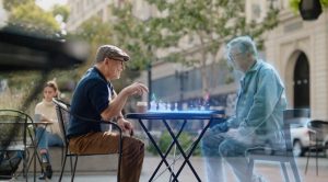 man playing chess with hologram